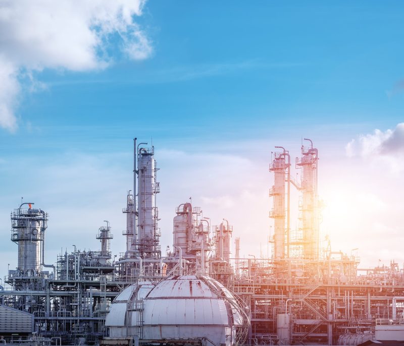 Manufacturing of petrochemical industrial or Oil and gas refinery plant with sunset sky