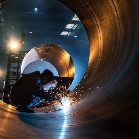 The welder is welding steel plates