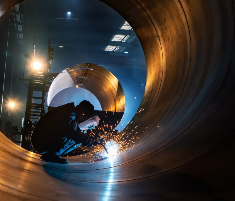 The welder is welding steel plates