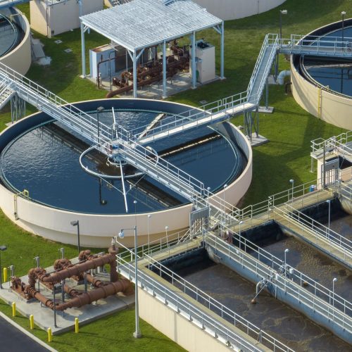 aerial-view-modern-water-cleaning-facility-urban-wastewater-treatment-plant-purification-process-removing-undesirable-chemicals-suspended-solids-gases-from-contaminated-liquid