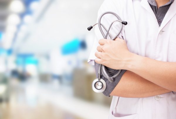 doctor-with-stethoscope-hands-hospital-background doctor-with-stethoscope-hands-hospital-background