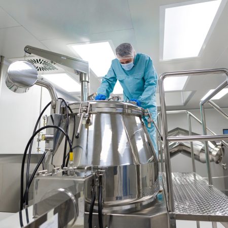 scientist in laboratiry look in metak tank