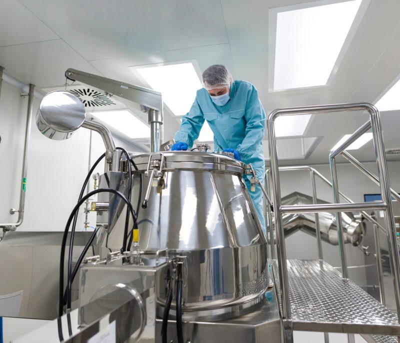 scientist in laboratiry look in metak tank