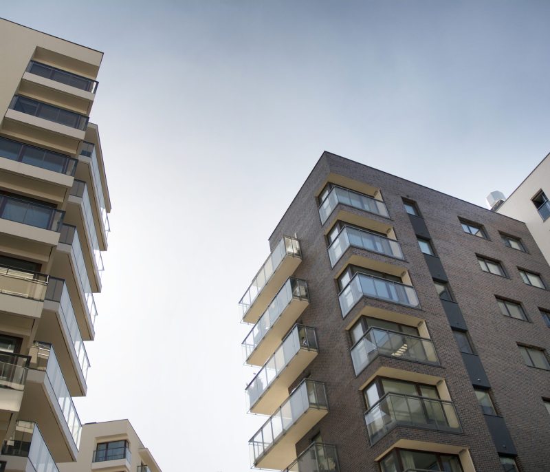 residential-building-sky-background-facade-modern-housing-construction-with-balconies